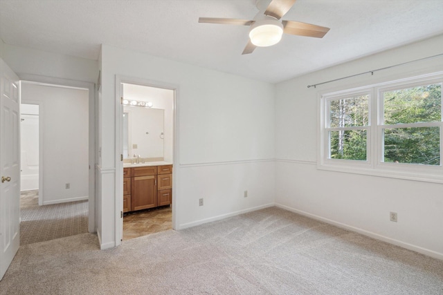 4540 Spinnaker Ln, Pleasant Lake, MI 49272 - unfurnished bedroom with light colored carpet, ensuite bath, and a ceiling fan