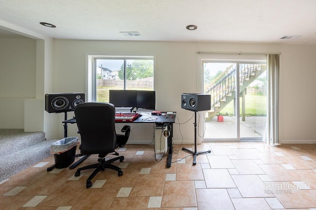 1591 Lillyview Ct SW, Wyoming, MI 49509 - home office featuring baseboards and light stone finish floors
