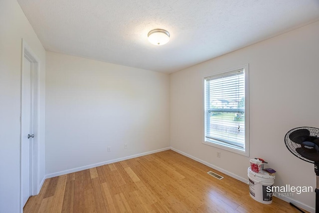 1591 Lillyview Ct SW, Wyoming, MI 49509 - empty room with light wood-style flooring and baseboards