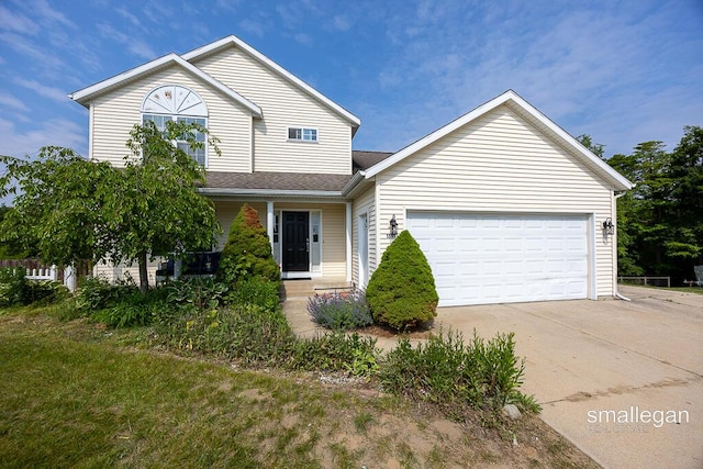 1591 Lillyview Ct SW, Wyoming, MI 49509 - traditional-style house with driveway, an attached garage, and covered porch