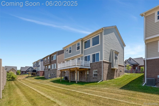 3923 Maple Ln, Auburn Hills, MI 48326 - rear view of house with brick siding, a residential view, a lawn, and a deck