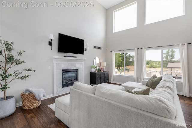 3923 Maple Ln, Auburn Hills, MI 48326 - living room with a fireplace, a high ceiling, and dark wood finished floors