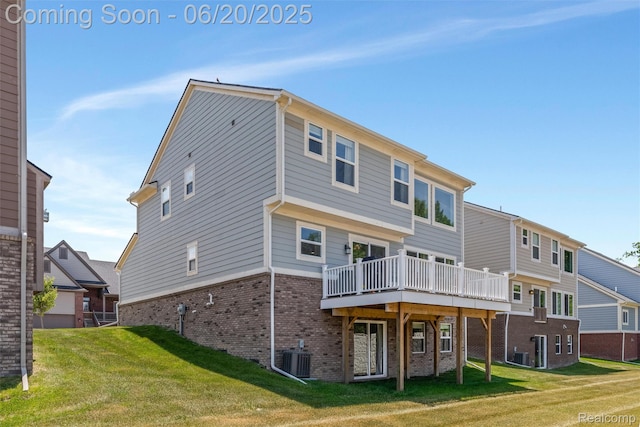 3923 Maple Ln, Auburn Hills, MI 48326 - back of property featuring brick siding, a yard, and a deck
