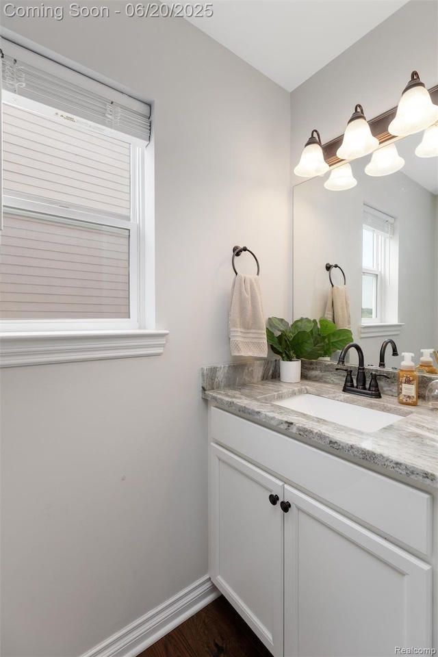 3923 Maple Ln, Auburn Hills, MI 48326 - bathroom with vanity and wood finished floors