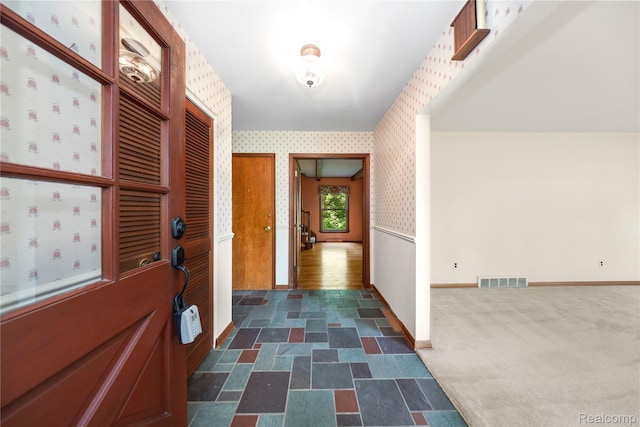 26165 Hidden Valley Dr, Farmington Hills, MI 48331 - foyer entrance featuring wallpapered walls and dark stone finish floors