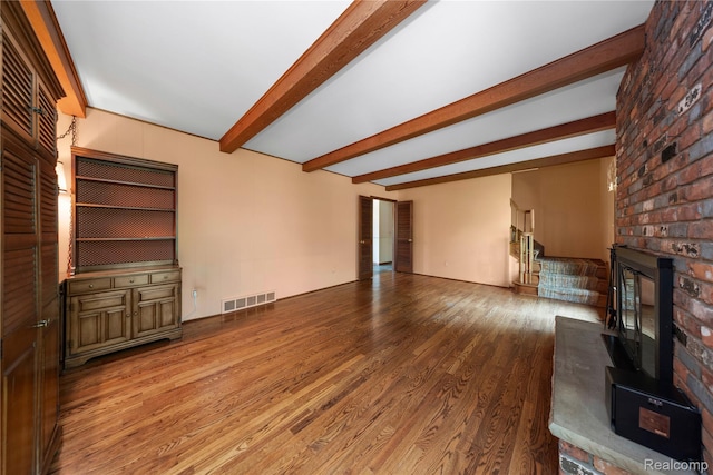 26165 Hidden Valley Dr, Farmington Hills, MI 48331 - unfurnished living room with a brick fireplace, wood finished floors, and beamed ceiling