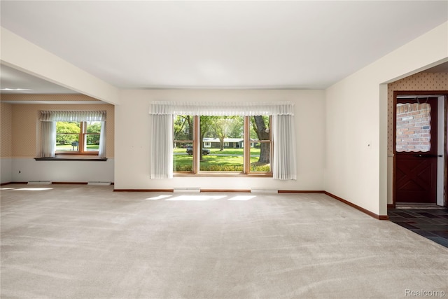 26165 Hidden Valley Dr, Farmington Hills, MI 48331 - unfurnished living room featuring carpet flooring and baseboards