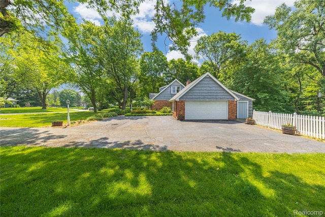 26165 Hidden Valley Dr, Farmington Hills, MI 48331 - garage featuring asphalt driveway