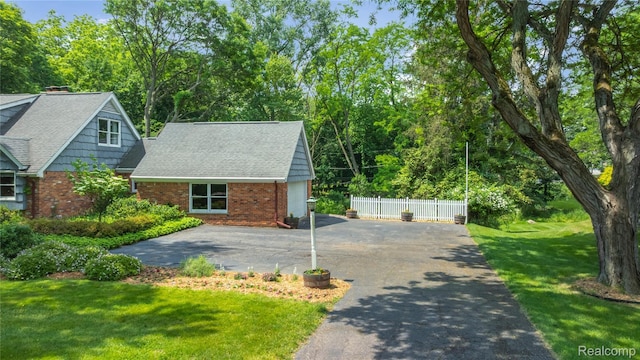 26165 Hidden Valley Dr, Farmington Hills, MI 48331 - view of front of property with brick siding, driveway, and roof with shingles