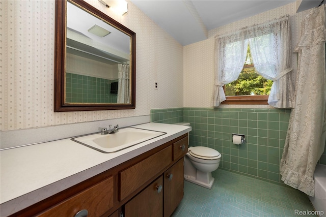 26165 Hidden Valley Dr, Farmington Hills, MI 48331 - bathroom with wallpapered walls, tile patterned flooring, vanity, a wainscoted wall, and tile walls