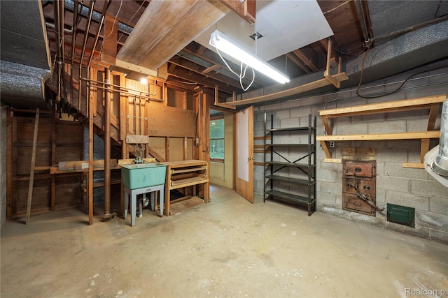 26165 Hidden Valley Dr, Farmington Hills, MI 48331 - unfinished basement featuring a workshop area