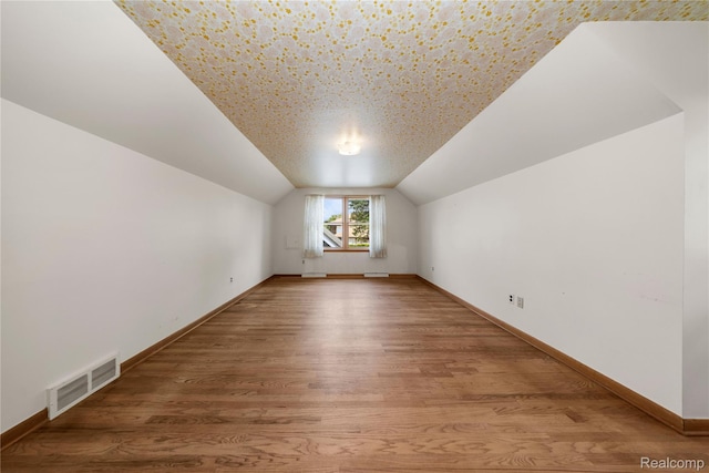 26165 Hidden Valley Dr, Farmington Hills, MI 48331 - additional living space with lofted ceiling and wood finished floors