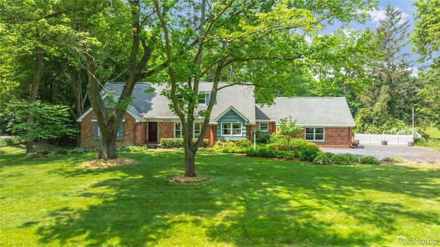 26165 Hidden Valley Dr, Farmington Hills, MI 48331 - view of front facade featuring brick siding and roof with shingles