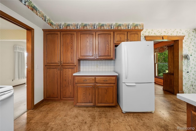26165 Hidden Valley Dr, Farmington Hills, MI 48331 - kitchen featuring white appliances, wallpapered walls, brown cabinetry, light countertops, and tasteful backsplash
