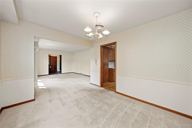 26165 Hidden Valley Dr, Farmington Hills, MI 48331 - empty room with wallpapered walls, a chandelier, and carpet floors