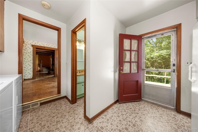 26165 Hidden Valley Dr, Farmington Hills, MI 48331 - entryway with washing machine and dryer and baseboards