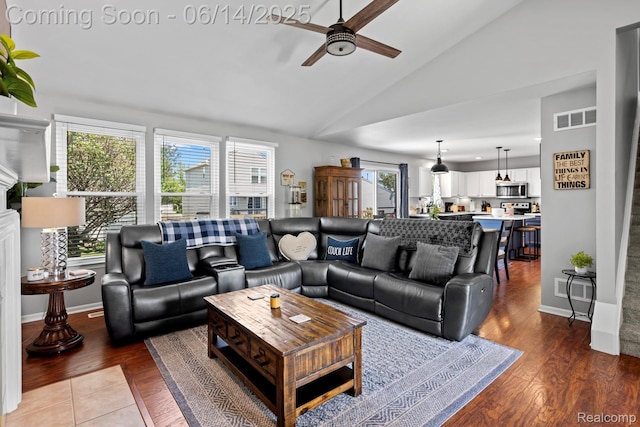 5031 Meadow Crest Cir, Holly, MI 48442 - living room with ceiling fan, plenty of natural light, wood finished floors, and high vaulted ceiling