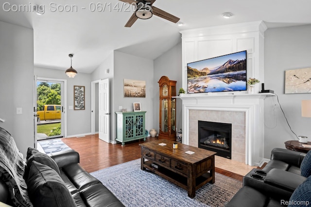 5031 Meadow Crest Cir, Holly, MI 48442 - living area with ceiling fan, a fireplace, wood finished floors, and lofted ceiling