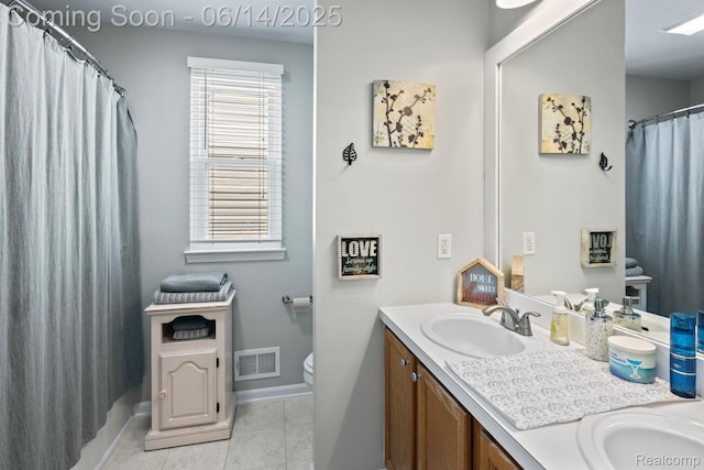 5031 Meadow Crest Cir, Holly, MI 48442 - bathroom with double vanity, tile patterned floors, and curtained shower