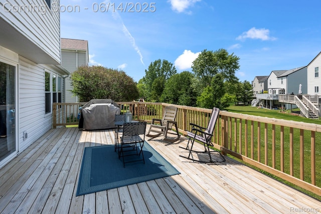 5031 Meadow Crest Cir, Holly, MI 48442 - wooden terrace featuring a grill, a yard, and a residential view