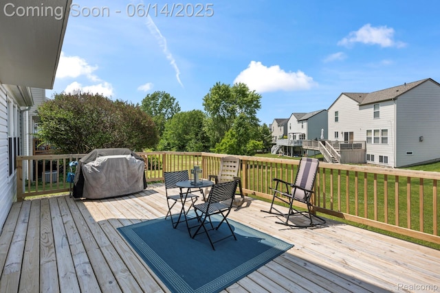 5031 Meadow Crest Cir, Holly, MI 48442 - wooden terrace with grilling area, a lawn, and a residential view