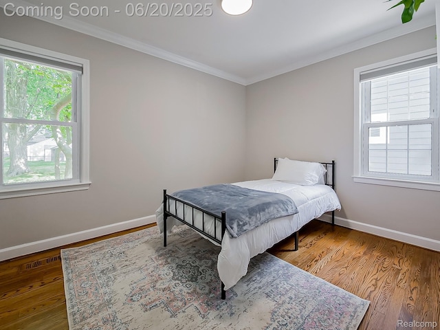 1036 Ferris Ave, Berkley, MI 48067 - bedroom featuring ornamental molding and wood finished floors