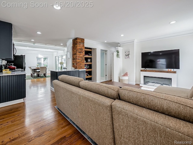 1036 Ferris Ave, Berkley, MI 48067 - living room with crown molding, recessed lighting, wood finished floors, and a glass covered fireplace