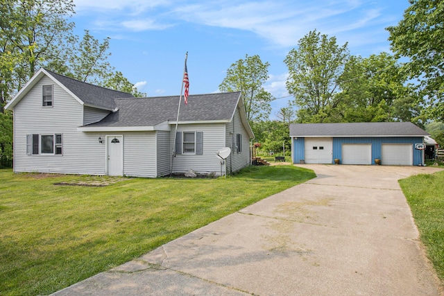 324 Cranson Rd, Bronson, MI 49028 - traditional-style home with a shingled roof, a garage, an outdoor structure, and a front yard