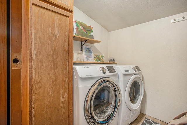 324 Cranson Rd, Bronson, MI 49028 - washroom with washer and dryer, cabinet space, a textured ceiling, and wood finished floors