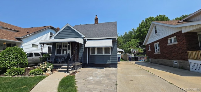 1154 Lincoln Ave, Rockwood, MI 48146 - bungalow-style house featuring covered porch and a chimney