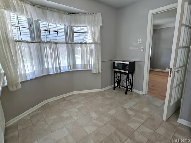 1154 Lincoln Ave, Rockwood, MI 48146 - dining room featuring baseboards and tile patterned flooring