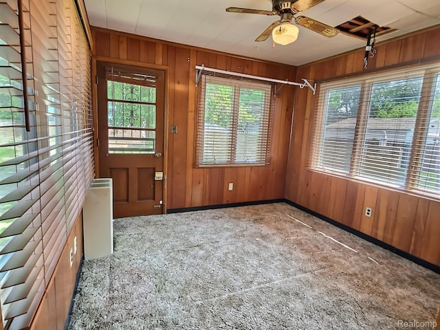 1154 Lincoln Ave, Rockwood, MI 48146 - spare room with wooden walls and ceiling fan