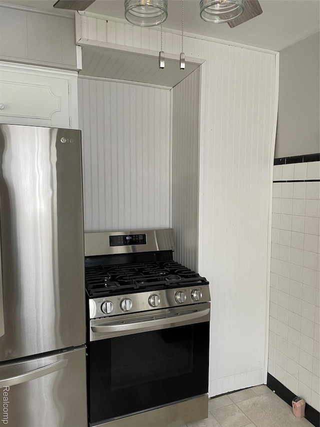 1154 Lincoln Ave, Rockwood, MI 48146 - kitchen with appliances with stainless steel finishes and light tile patterned floors