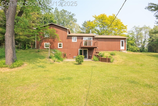 1931 E Marr Rd, Howell, MI 48855 - back of house with a lawn and a deck