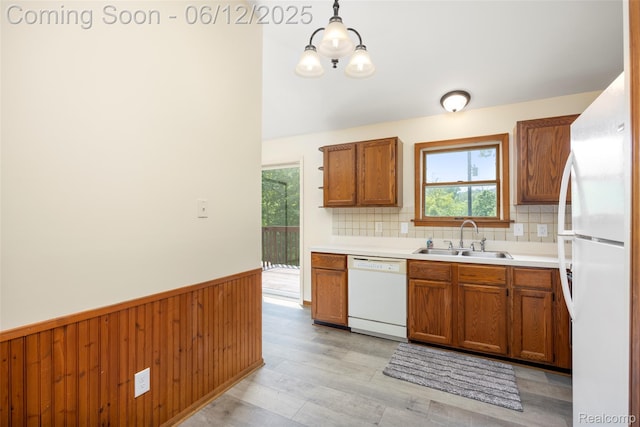 1931 E Marr Rd, Howell, MI 48855 - kitchen featuring white appliances, plenty of natural light, brown cabinetry, wainscoting, and open shelves