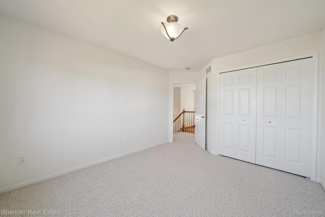 61 Old Carriage Ln, Lapeer, MI 48446 - unfurnished bedroom with carpet floors and a closet