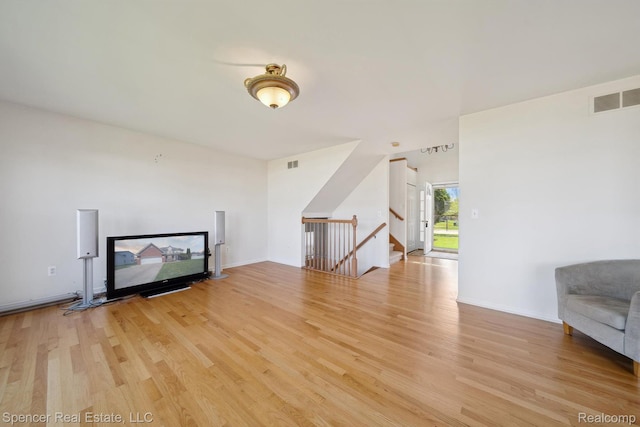 61 Old Carriage Ln, Lapeer, MI 48446 - unfurnished living room with light wood-type flooring and baseboards