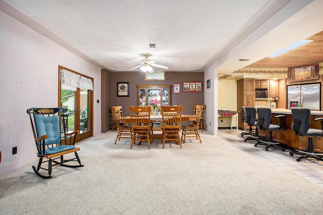 520 Groat Rd, Dowling, MI 49050 - dining space with ceiling fan and light colored carpet