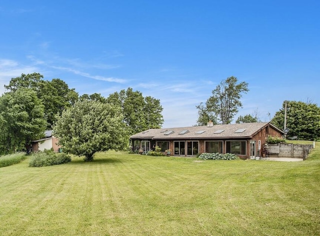 520 Groat Rd, Dowling, MI 49050 - rear view of house with a yard and a chimney