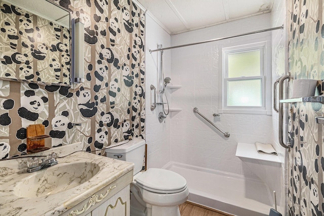 300 Basswood Ter, Brooklyn, MI 49230 - bathroom featuring a tile shower, vanity, and ornamental molding