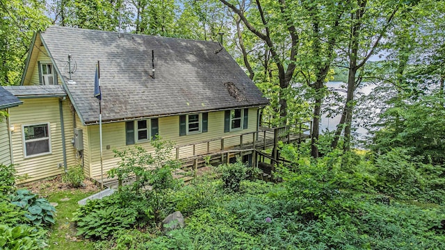 300 Basswood Ter, Brooklyn, MI 49230 - rear view of house featuring roof with shingles, a deck, and stairway