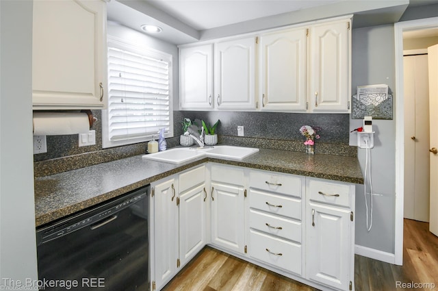 4462 Dye Rd, Swartz Creek, MI 48473 - kitchen with black dishwasher, dark countertops, wood finished floors, and white cabinets