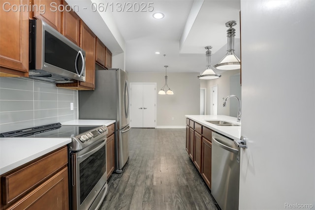 525 W Lafayette Blvd Unit 19C, Detroit, MI 48226 - kitchen with appliances with stainless steel finishes, tasteful backsplash, dark wood-style floors, recessed lighting, and light countertops
