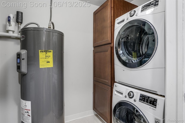 525 W Lafayette Blvd Unit 19C, Detroit, MI 48226 - laundry area featuring water heater, stacked washer and clothes dryer, and cabinet space