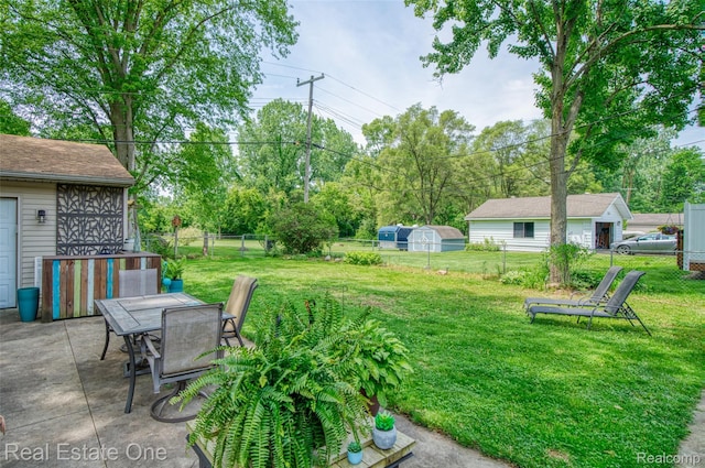 5320 Leland St, Brighton, MI 48116 - fenced backyard with a patio area and outdoor dining space