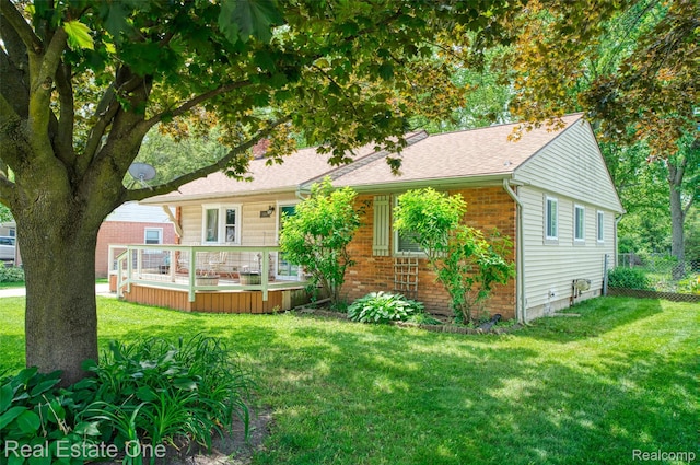 5320 Leland St, Brighton, MI 48116 - view of front of home featuring brick siding, a deck, and roof with shingles