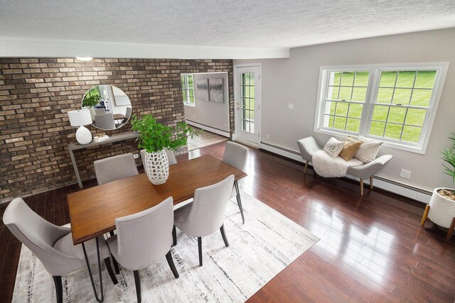 6170 Gregory Rd, Dexter, MI 48130 - dining room with brick wall, a textured ceiling, wood finished floors, and baseboard heating