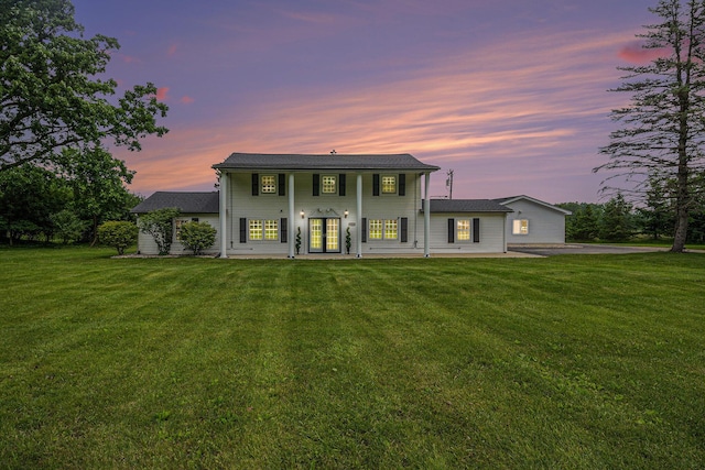 6170 Gregory Rd, Dexter, MI 48130 - view of front of property featuring french doors and a yard