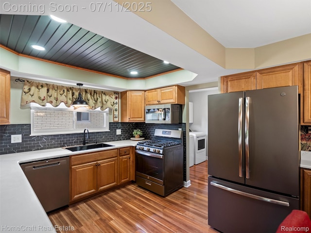 7363 Provincial Rd, Canton, MI 48187 - kitchen with appliances with stainless steel finishes, wood finished floors, light countertops, backsplash, and recessed lighting