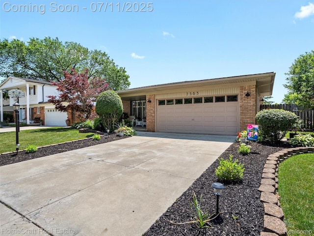7363 Provincial Rd, Canton, MI 48187 - view of front of property with brick siding, concrete driveway, and a garage